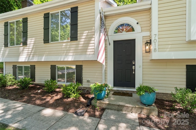 7018 Rollingridge Dr, Charlotte, NC 28211 - property entrance with a chimney
