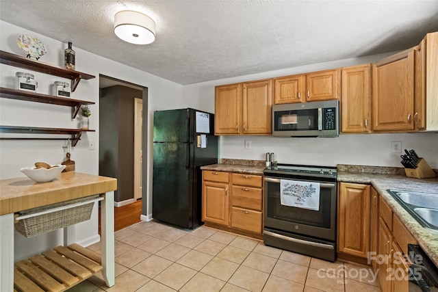 7018 Rollingridge Dr, Charlotte, NC 28211 - kitchen with stainless steel appliances, light tile patterned floors, a textured ceiling, a sink, and open shelves