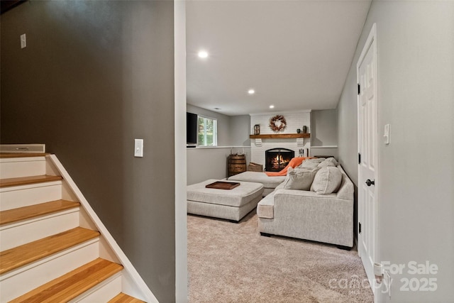 7018 Rollingridge Dr, Charlotte, NC 28211 - carpeted living room featuring a fireplace, recessed lighting, and stairway