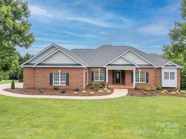 182 Kensington Dr, Forest City, NC 28043 - view of front facade with a front lawn, brick siding, and a shingled roof