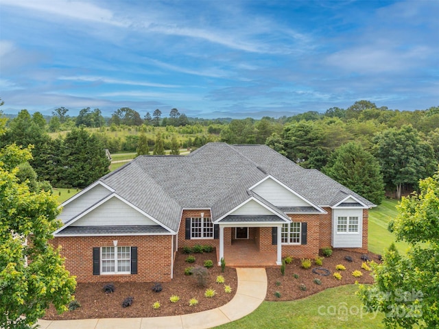 182 Kensington Dr, Forest City, NC 28043 - traditional home featuring brick siding, a front yard, and roof with shingles