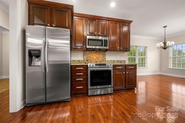 182 Kensington Dr, Forest City, NC 28043 - kitchen featuring stainless steel appliances, crown molding, dark wood-style flooring, a chandelier, and baseboards