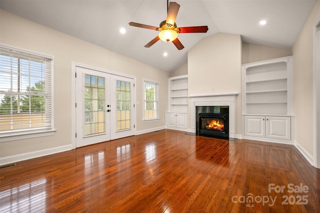 182 Kensington Dr, Forest City, NC 28043 - unfurnished living room with french doors, wood-type flooring, vaulted ceiling, baseboards, and ceiling fan