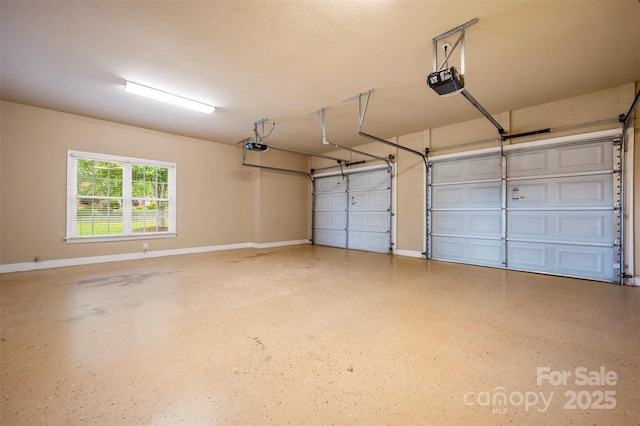 182 Kensington Dr, Forest City, NC 28043 - garage featuring a garage door opener and baseboards