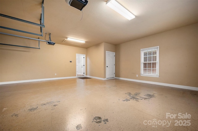 182 Kensington Dr, Forest City, NC 28043 - garage with a garage door opener and baseboards