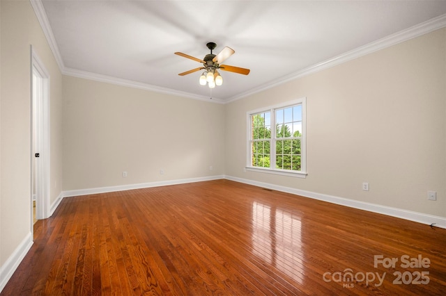 182 Kensington Dr, Forest City, NC 28043 - empty room with wood finished floors, a ceiling fan, ornamental molding, and baseboards