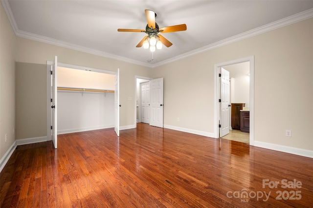 182 Kensington Dr, Forest City, NC 28043 - unfurnished bedroom with ornamental molding, wood finished floors, baseboards, and a closet