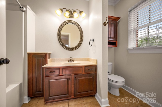 182 Kensington Dr, Forest City, NC 28043 - bathroom featuring toilet, vanity, tile patterned floors, and baseboards