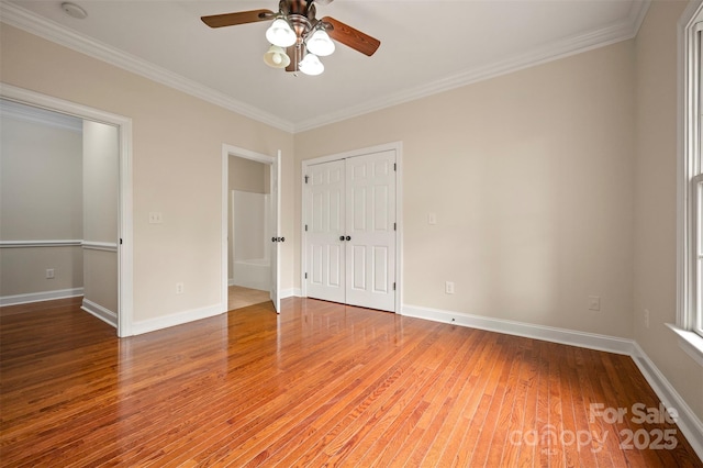 182 Kensington Dr, Forest City, NC 28043 - unfurnished bedroom with light wood-style flooring, ornamental molding, a closet, baseboards, and a ceiling fan