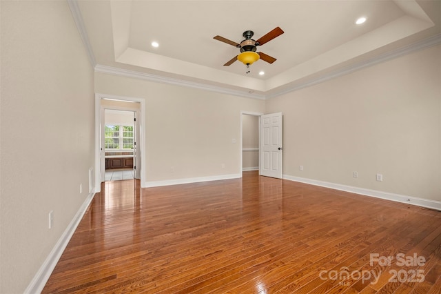 182 Kensington Dr, Forest City, NC 28043 - empty room featuring a raised ceiling, ceiling fan, wood finished floors, crown molding, and recessed lighting