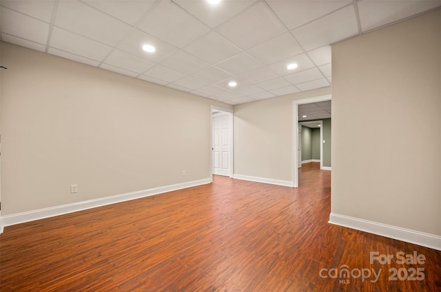 182 Kensington Dr, Forest City, NC 28043 - unfurnished room featuring wood finished floors, baseboards, a paneled ceiling, and recessed lighting
