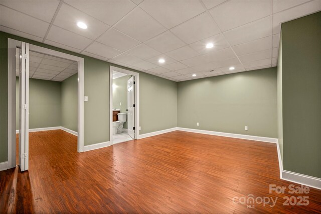 182 Kensington Dr, Forest City, NC 28043 - finished below grade area featuring wood finished floors, a paneled ceiling, baseboards, and recessed lighting