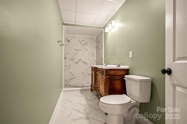 182 Kensington Dr, Forest City, NC 28043 - full bathroom with marble look tile flooring, vanity, baseboards, a shower, and toilet