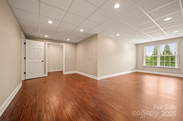 182 Kensington Dr, Forest City, NC 28043 - unfurnished room with wood finished floors, baseboards, a drop ceiling, and recessed lighting