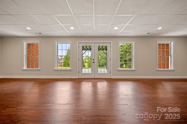 182 Kensington Dr, Forest City, NC 28043 - unfurnished room with baseboards, hardwood / wood-style flooring, a drop ceiling, and recessed lighting
