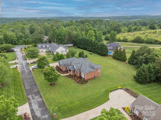 182 Kensington Dr, Forest City, NC 28043 - aerial view of property and surrounding area with a heavily wooded area