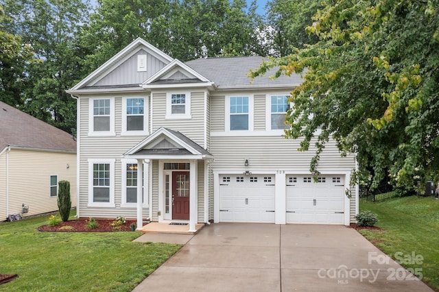 308 Planters Way, Mount Holly, NC 28120 - view of front of home with driveway, a garage, board and batten siding, and a front yard