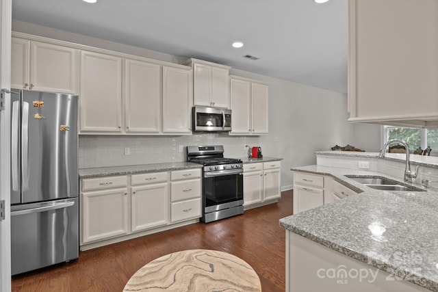 308 Planters Way, Mount Holly, NC 28120 - kitchen featuring stainless steel appliances, a sink, white cabinetry, decorative backsplash, and recessed lighting