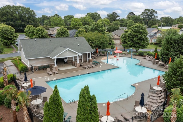 308 Planters Way, Mount Holly, NC 28120 - community pool featuring a patio