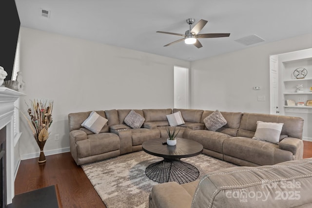 308 Planters Way, Mount Holly, NC 28120 - living area with a ceiling fan, wood finished floors, a fireplace, and built in features