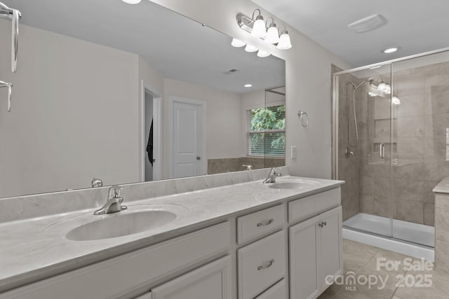 308 Planters Way, Mount Holly, NC 28120 - bathroom with double vanity, a stall shower, tile patterned floors, and recessed lighting