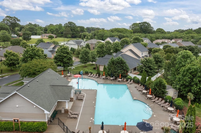 308 Planters Way, Mount Holly, NC 28120 - community pool with a patio area, view of wooded area, and a residential view