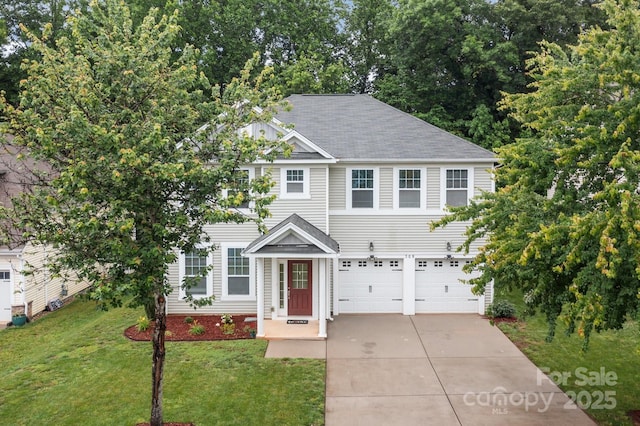 308 Planters Way, Mount Holly, NC 28120 - view of front facade with concrete driveway, a garage, a front yard, and roof with shingles