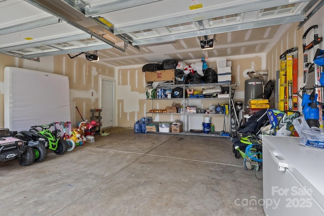 308 Planters Way, Mount Holly, NC 28120 - garage featuring a garage door opener