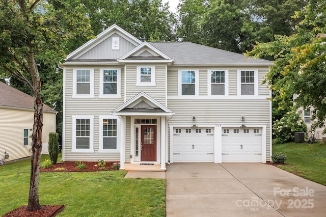 308 Planters Way, Mount Holly, NC 28120 - view of front of house with a garage, driveway, board and batten siding, and a front lawn