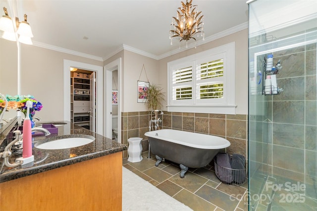 141 Eastover Dr SE, Concord, NC 28025 - full bath featuring vanity, a soaking tub, tile walls, toilet, and a chandelier