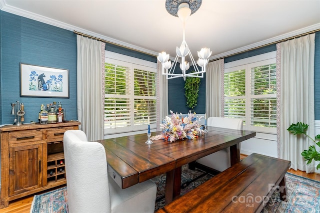 141 Eastover Dr SE, Concord, NC 28025 - dining room with crown molding, a chandelier, and light wood-style flooring
