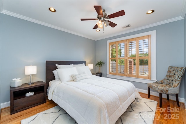 141 Eastover Dr SE, Concord, NC 28025 - bedroom with wood finished floors, baseboards, recessed lighting, crown molding, and a ceiling fan