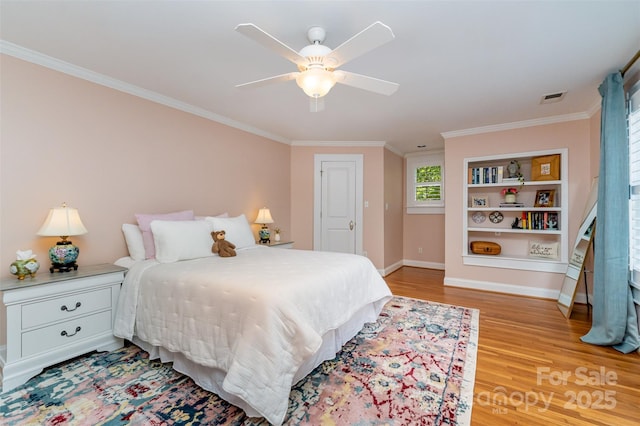 141 Eastover Dr SE, Concord, NC 28025 - bedroom with light wood-style flooring, baseboards, ornamental molding, and ceiling fan