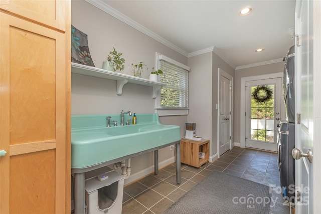141 Eastover Dr SE, Concord, NC 28025 - laundry area with plenty of natural light, crown molding, baseboards, recessed lighting, and dark tile patterned floors