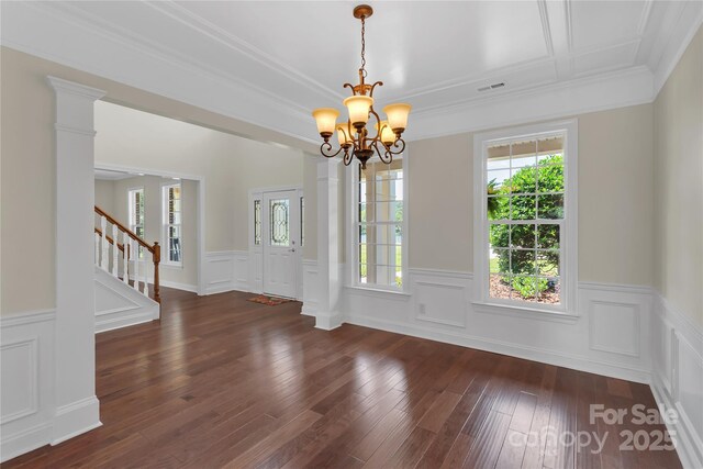 3068 River Rd, Shelby, NC 28152 - unfurnished dining area with a chandelier, a wainscoted wall, stairway, wood-type flooring, and ornamental molding