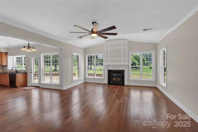 3068 River Rd, Shelby, NC 28152 - unfurnished living room featuring lofted ceiling, baseboards, a fireplace, a sink, and dark wood-style floors