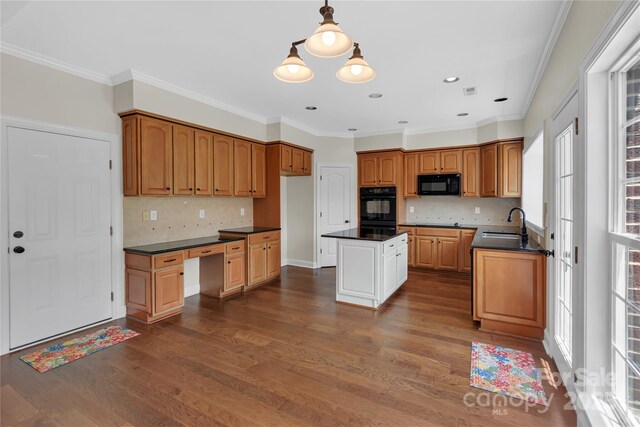 3068 River Rd, Shelby, NC 28152 - kitchen with dark countertops, black microwave, dark wood finished floors, ornamental molding, and backsplash