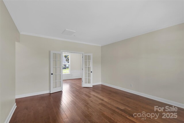 3068 River Rd, Shelby, NC 28152 - empty room with french doors, dark wood-style floors, crown molding, and baseboards