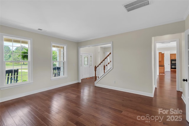 3068 River Rd, Shelby, NC 28152 - spare room with baseboards, dark wood-type flooring, ornamental molding, and stairway