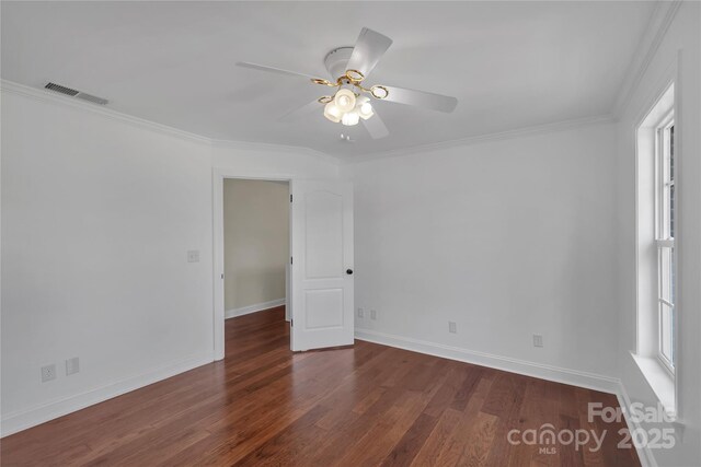 3068 River Rd, Shelby, NC 28152 - empty room featuring dark wood-type flooring, ceiling fan, ornamental molding, and baseboards