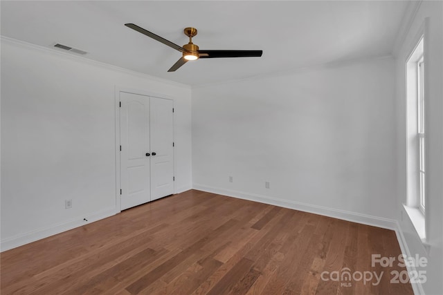 3068 River Rd, Shelby, NC 28152 - unfurnished bedroom with crown molding, wood finished floors, and baseboards