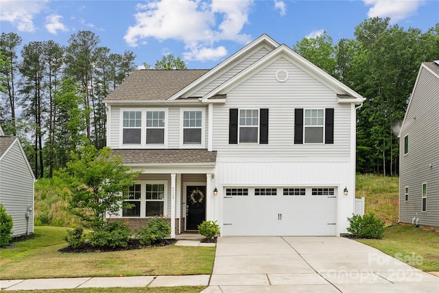 5113 Saddleback Dr, Mount Holly, NC 28120 - view of front of house with driveway, roof with shingles, a front yard, and a garage