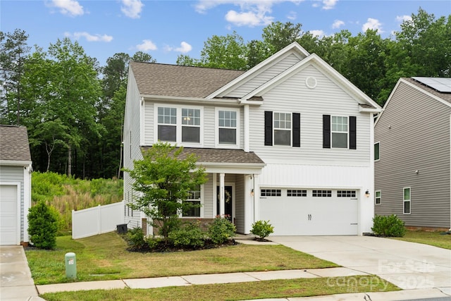 5113 Saddleback Dr, Mount Holly, NC 28120 - traditional-style home with driveway, a shingled roof, an attached garage, and central AC unit