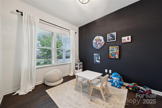 5113 Saddleback Dr, Mount Holly, NC 28120 - playroom featuring wood finished floors and baseboards