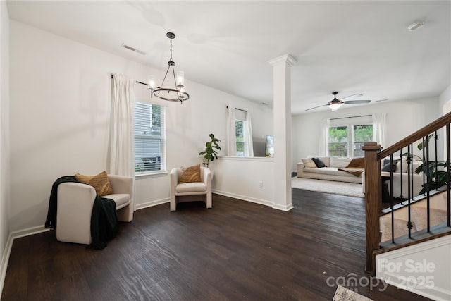 5113 Saddleback Dr, Mount Holly, NC 28120 - living area with dark wood finished floors, stairs, baseboards, a chandelier, and ceiling fan