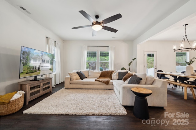 5113 Saddleback Dr, Mount Holly, NC 28120 - living room featuring dark wood-style floors, a chandelier, and ceiling fan