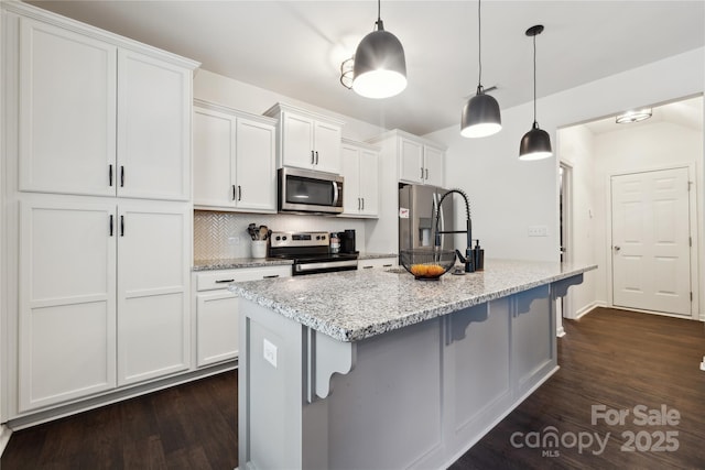 5113 Saddleback Dr, Mount Holly, NC 28120 - kitchen featuring stainless steel appliances, dark wood-style flooring, white cabinetry, and tasteful backsplash