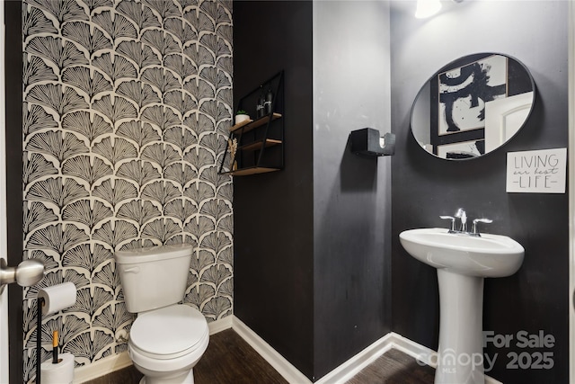 5113 Saddleback Dr, Mount Holly, NC 28120 - half bath with toilet, wood finished floors, baseboards, and a sink
