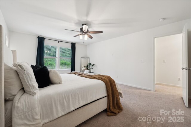 5113 Saddleback Dr, Mount Holly, NC 28120 - bedroom featuring light carpet, a ceiling fan, and baseboards