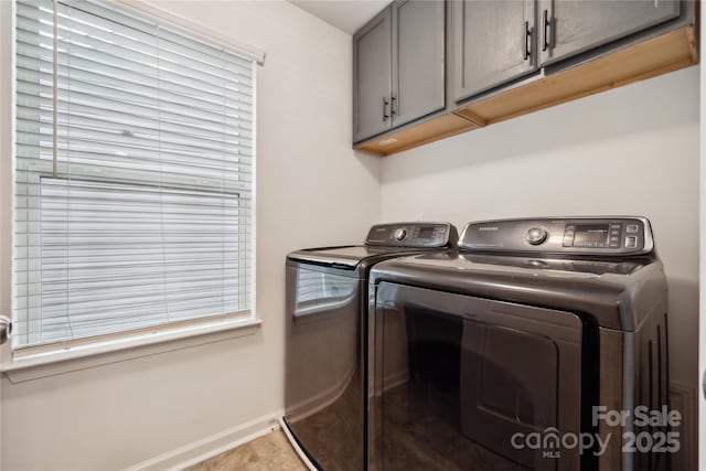 5113 Saddleback Dr, Mount Holly, NC 28120 - laundry room with washing machine and dryer, cabinet space, and baseboards